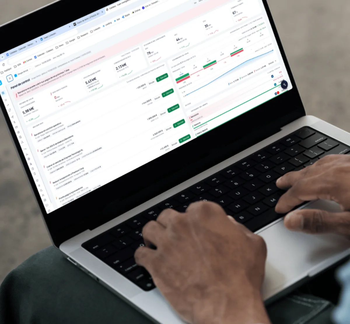 The Catalaxy treasury dashboard on a laptop, showing cash forecasting and bank reconciliation