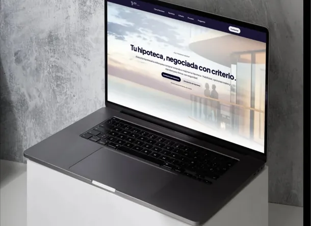 The JCA Finance Group site open on a laptop